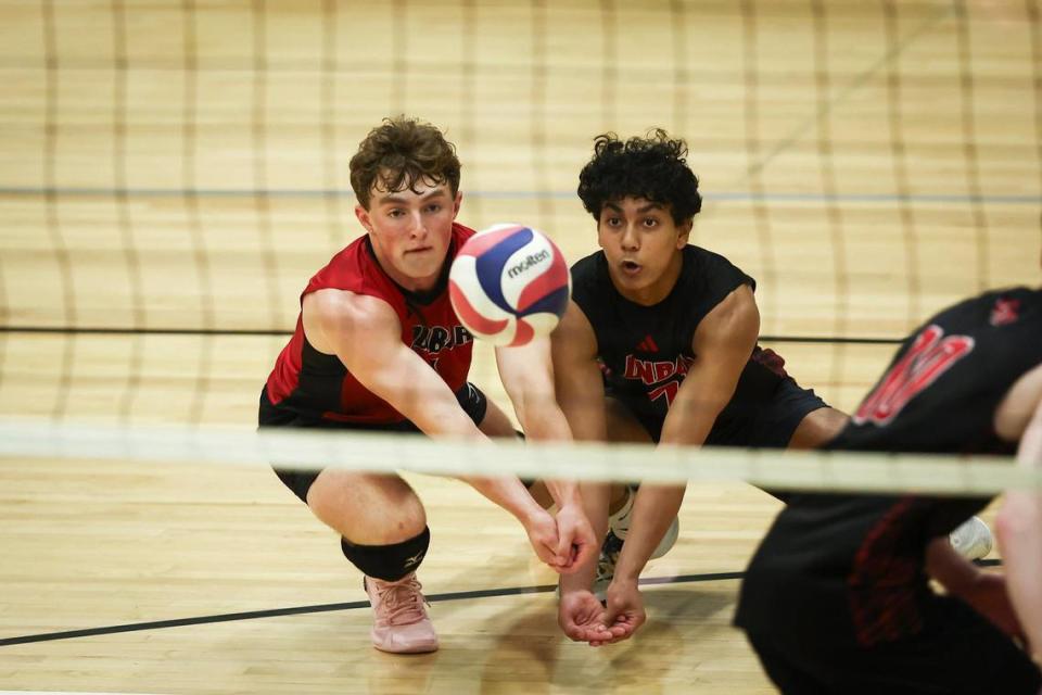 Paul Laurence Dunbar’s Kasen Johnston sets the ball against Trinity during the KVCA boys volleyball semifinals at Western Hills High School in Frankfort on Thursday.
