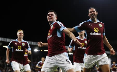 Britain Football Soccer - Burnley v Watford - Premier League - Turf Moor - 26/9/16 Burnley's Michael Keane celebrates scoring their second goal with George Boyd and teammates Action Images via Reuters / Jason Cairnduff Livepic