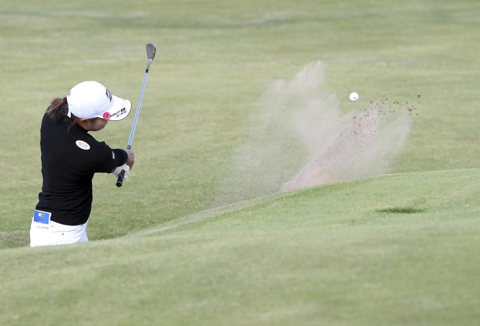 Japan's Sayaka Takahashi plays her shot from the 14th green bunker during the second round of the Women's British Open golf championship, in Muirfield, Scotland Friday, Aug. 5, 2022. (AP Photo/Scott Heppell)