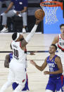 Portland Trail Blazers forward Carmelo Anthony (00) shoots over Los Angeles Clippers guard Landry Shamet (20) during the second half in an NBA basketball game Saturday, Aug. 8, 2020, in Lake Buena Vista, Fla. (Kim Klement/Pool Photo via AP)