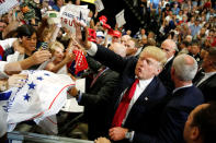 <p>Republican presidential candidate Donald Trump blows a kiss as he signs autographs after a rally with supporters in Albuquerque, N.M., Tuesday, May 24, 2016. (Reuters/Jonathan Ernst) </p>