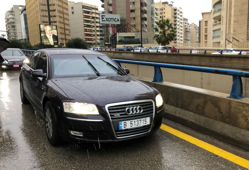 A car arrives outside the building of Lebanese Press Syndicate where former Nissan chairman Carlos Ghosn is expected to hold a news conference in Beirut