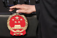 Officials prepares a podium for China's President Xi Jinping during the APEC CEO Summit 2018 in Port Moresby, Papua New Guinea, Saturday, Nov. 17, 2018. (Fazry Ismail/Pool Photo via AP)