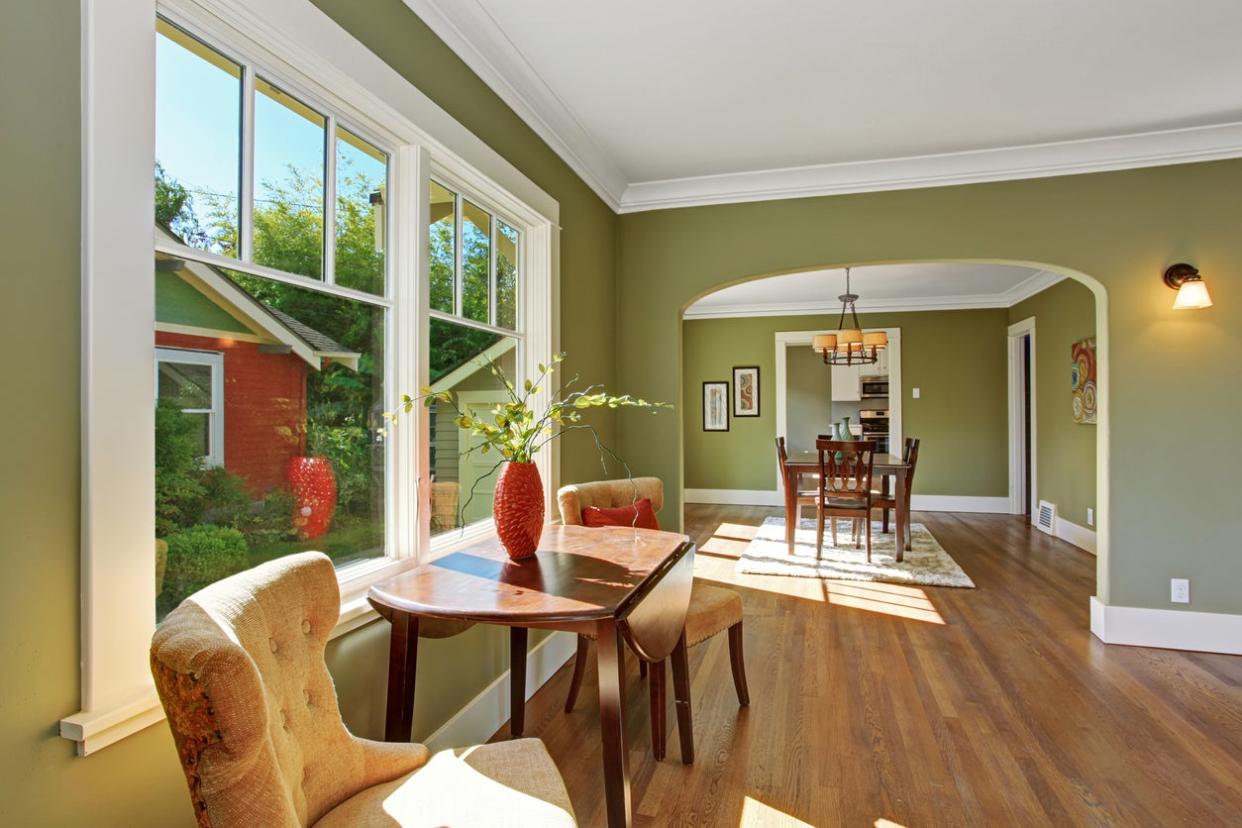 Sitting area by the window with table and chairs