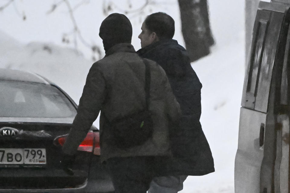 Wall Street Journal reporter Evan Gershkovich, right, is escorted to the Lefortovsky court in Moscow, Russia, Friday, Jan. 26, 2024. A Moscow court will decide on January 26, 2024 whether to extend the pre-trial detention of detained Wall Street Journal reporter Evan Gershkovich, who was detained last March on spying charges during a reporting trip to the Urals. (Alexander Nemenov/Pool Photo via AP)