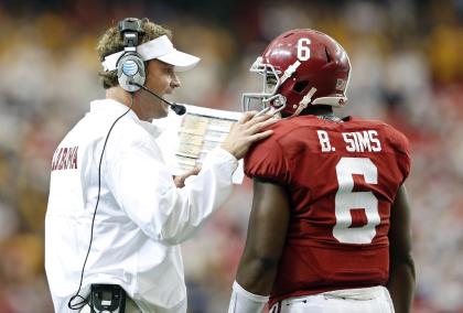 Alabama offensive coordinator Lane Kiffin (L) talks to QB Blake Sims during a win over West Virginia. (AP)