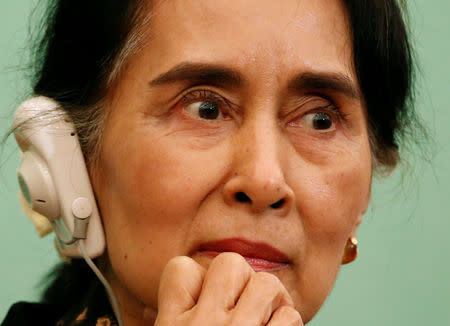 Myanmar State Counselor Aung San Suu Kyi listens to a reporter's question during a news conference at the Japan National Press Club in Tokyo, Japan November 4, 2016. REUTERS/Issei Kato