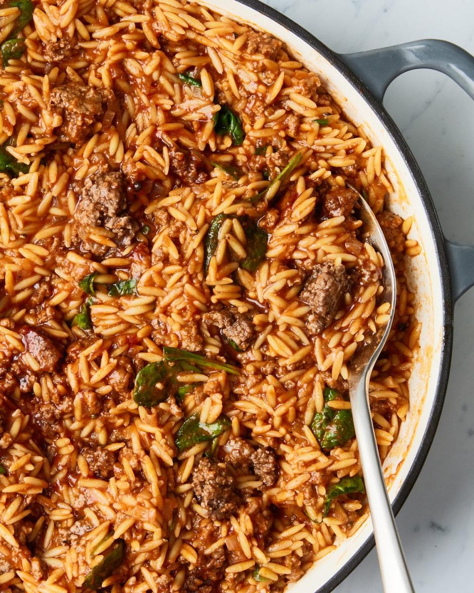 orzo in a tomato sauce with meatballs and basil