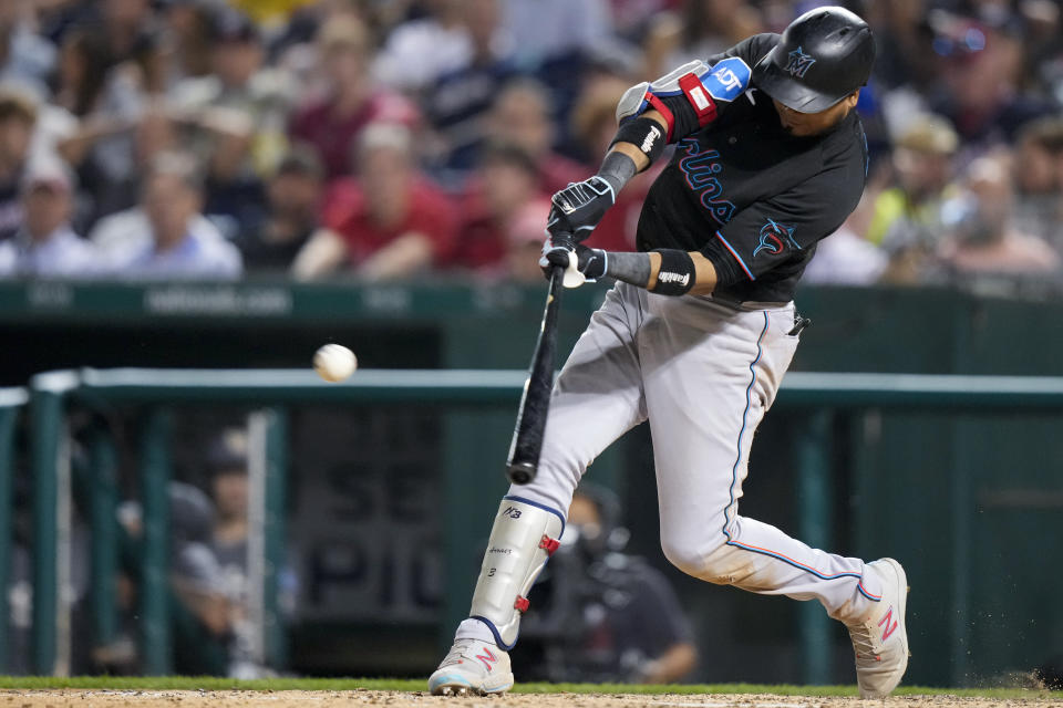 Miami Marlins' Luis Arraez hits a single during the seventh inning of the team's baseball game Washington Nationals at Nationals Park, Friday, June 16, 2023, in Washington. The Marlins won 6-5. (AP Photo/Alex Brandon)