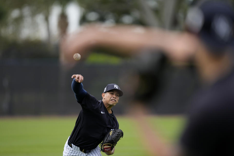 New York Yankees relief pitcher Jonathan Loaisiga throws during a baseball spring training workout Thursday, Feb. 15, 2024, in Tampa, Fla. (AP Photo/Charlie Neibergall)