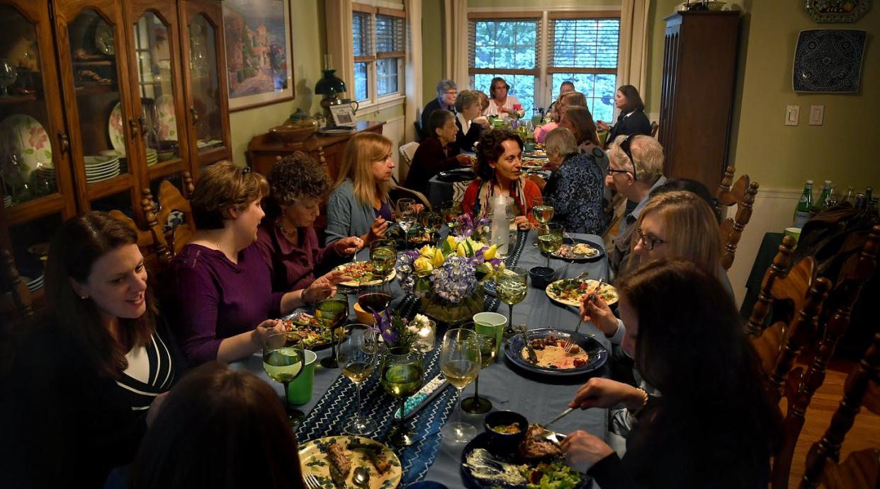 <span class="caption">Women who are collectively donating to an all-girls school in Peru discuss their charitable giving in a Vienna, Virginia dining room.</span> <span class="attribution"><a class="link " href="https://www.gettyimages.com/detail/news-photo/dinner-for-nearly-two-dozen-at-the-dining-for-women-potluck-news-photo/691054828" rel="nofollow noopener" target="_blank" data-ylk="slk:Michael S. Williamson/The Washington Post via Getty Images;elm:context_link;itc:0;sec:content-canvas">Michael S. Williamson/The Washington Post via Getty Images</a></span>