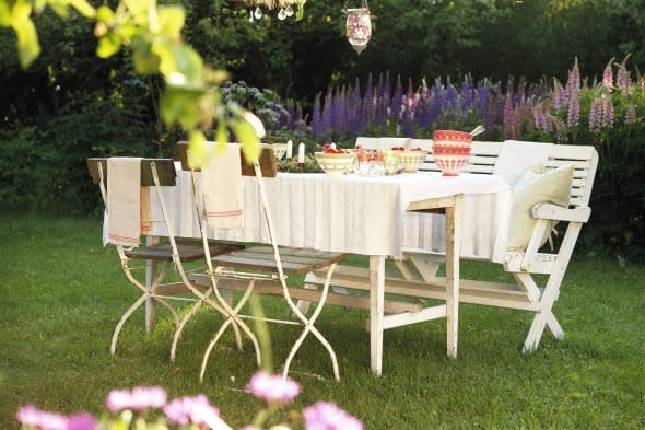 A set table in a garden.