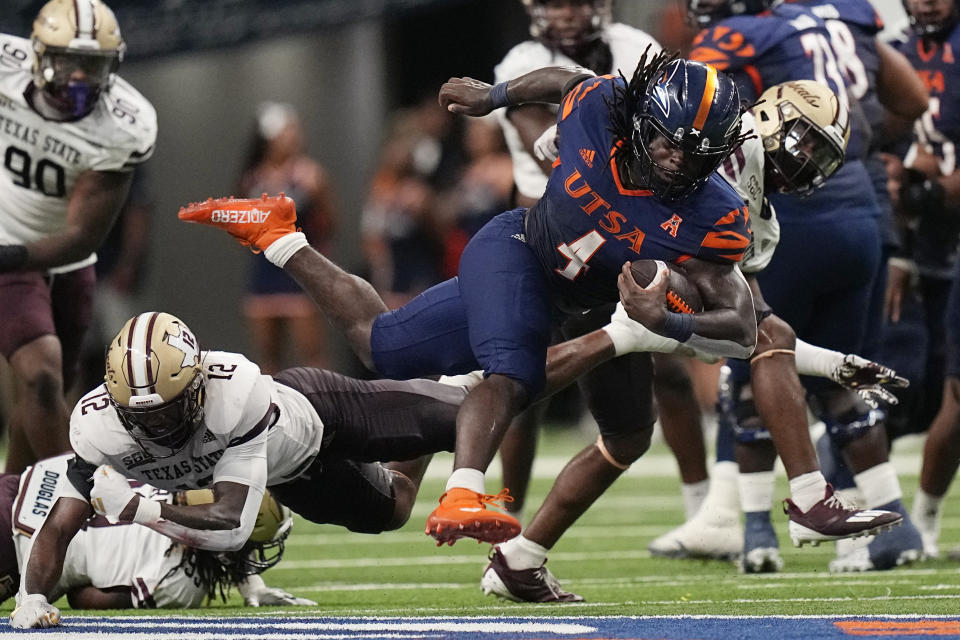 UTSA running back Kevorian Barnes (4) runs against Texas State during the second half of an NCAA college football game, Saturday, Sept. 9, 2023, in San Antonio. (AP Photo/Eric Gay)