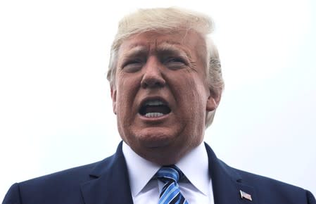 FILE PHOTO: U.S. President Trump talks to reporters as he boards Air Force One for travel to Pennsylvania from Morristown Municipal Airport in Morristown, New Jersey