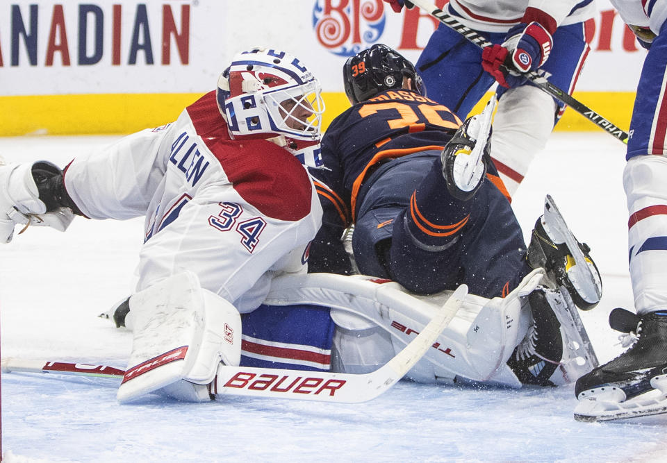 Edmonton Oilers' Alex Chiasson (39) crashes into Montreal Canadiens' goalie Jake Allen (34) during the second period of an NHL hockey game, Wednesday, April 21, 2021 in Edmonton, Alberta. (Jason Franson/The Canadian Press via AP)