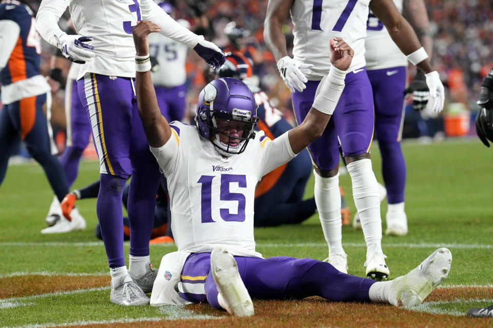 Minnesota Vikings quarterback Joshua Dobbs (15) celebrates his touchdown against the Denver Broncos during the second half on an NFL football game, Sunday, Nov. 19, 2023, in Denver. (AP Photo/David Zalubowski)