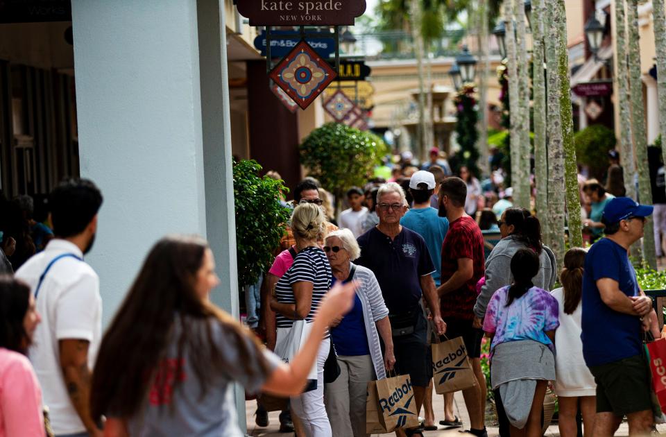 Shoppers looking for deals pack Miramar Outlets in Estero on Black Friday on Friday, Nov. 24, 2023.