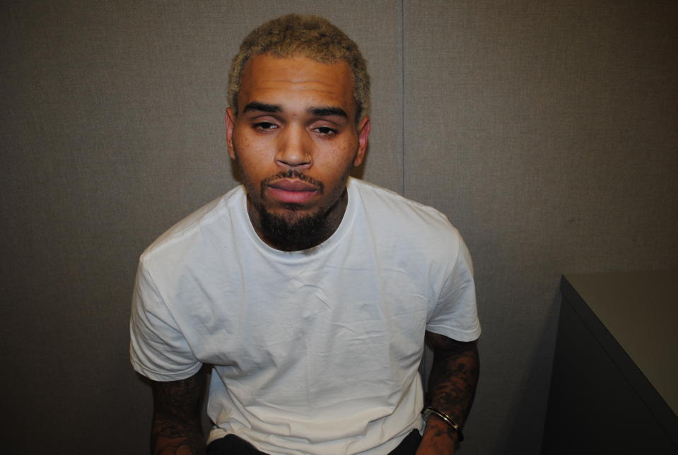 This photo provided by U.S. Attorney's Office for the District of Columbia, shows a photo of Chris Brown, one of five photos that prosecutors entered into evidence in the assault trial of Christopher Hollosy, the bodyguard of Brown. A judge approved the release of the five photos on Monday, May 5, 2014. Prosecutors say Brown and Hollosy hit 20-year-old Parker Adams after Adams tried to get into a photo Brown was taking with two women outside his tour bus. Hollosy was convicted of assault and plans to appeal. Brown’s trial was delayed for months. Hollosy told police he, not Brown, punched Adams. (AP Photo/U.S. Attorney's Office for the District of Columbia)