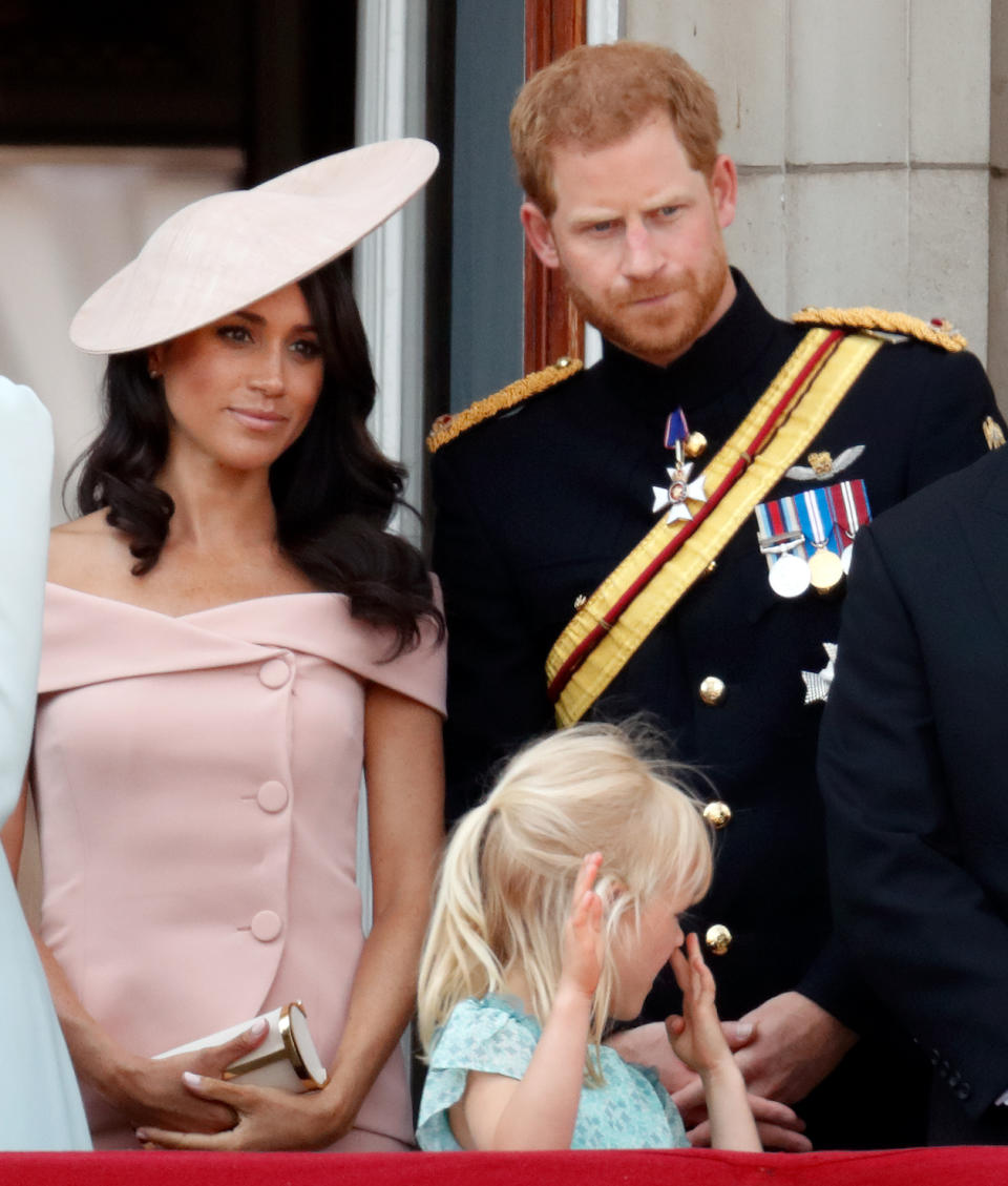 Prince Harry could be seen over the weekend prompting Meghan Markle about when she should curtsy to the Queen. Photo: Getty Images