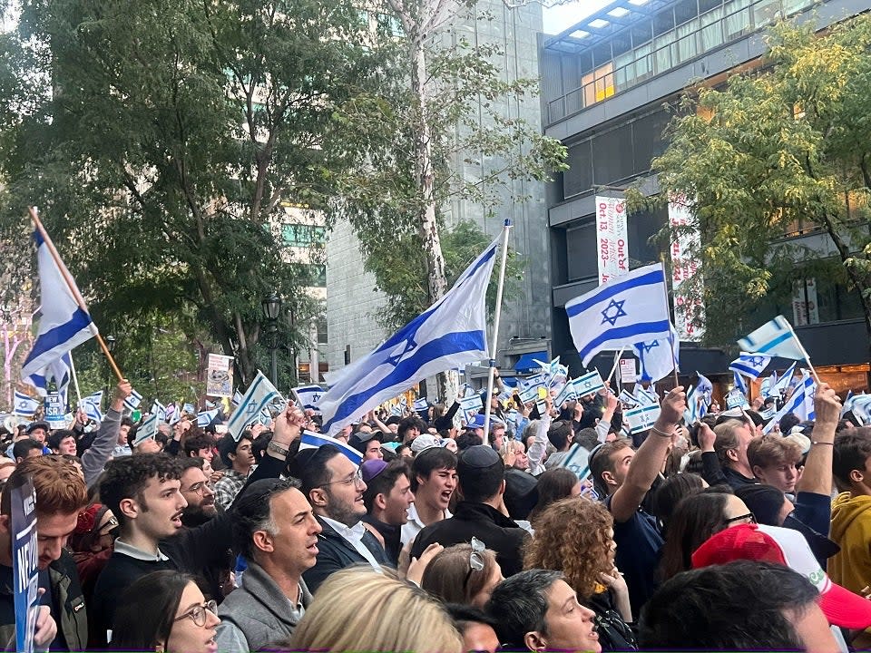 A large crowd of Israel supporters holding Israeli flags in NYC