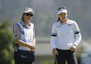 Brooke Henderson, right, of Canada, and her caddie and sister, Brittany Henderson, look over the ninth green of the Lake Merced Golf Club during the first round of the LPGA Mediheal Championship golf tournament Thursday, May 2, 2019, in Daly City, Calif. (AP Photo/Eric Risberg)