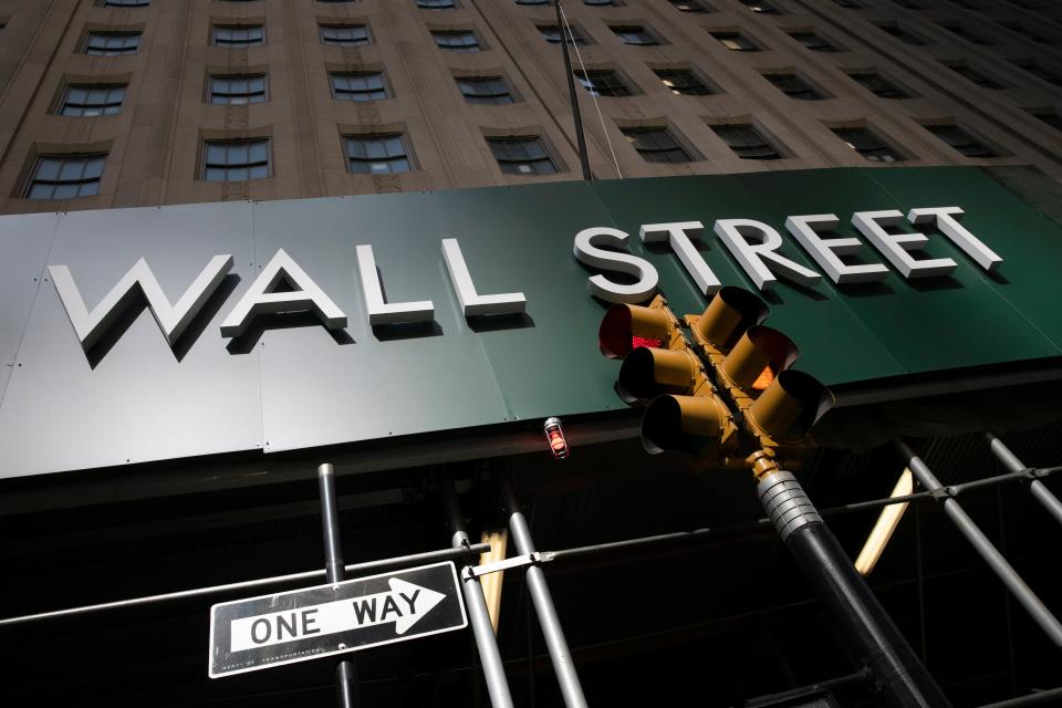 A sign for a Wall Street building is shown, Tuesday, June 16, 2020.