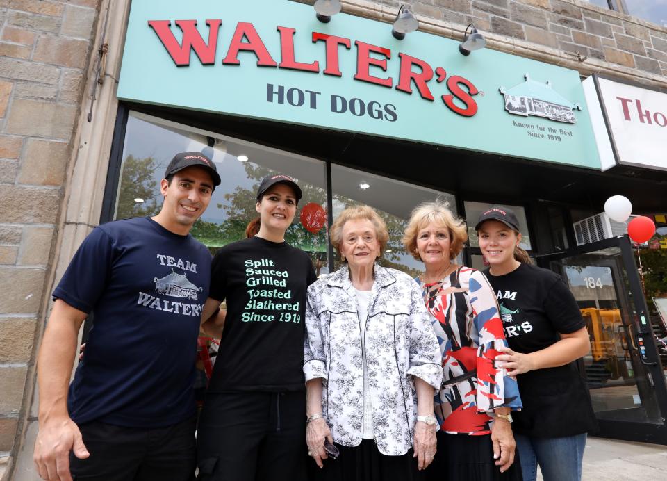 Gloria Warrington, center, wife of longtime Walter's Hot Dogs owner Eugene Warrington, with her daughter Christine Warrington and grandchildren, Gene-Christian Baca, left, Christine Sand, and Katharine Woodward  (now DeCicco) on opening day of Walter's Hot Dogs in White Plains Aug. 26, 2018.