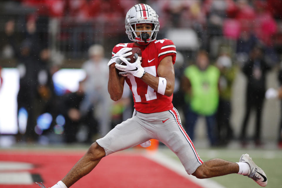 Ohio State receiver Chris Olave catches a touchdown pass against Wisconsin during the first half of an NCAA college football game Saturday, Oct. 26, 2019, in Columbus, Ohio. (AP Photo/Jay LaPrete)