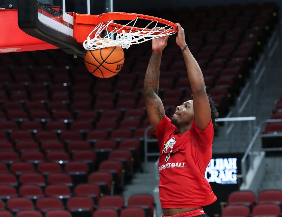 U of L basketball warms up ahead of their matchup with Pepperdine at the Yum Center in Louisville, Ky. on Dec. 17, 2023.