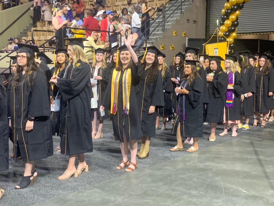 Framingham State University graduates file into the DCU Center in Worcester for the commencement ceremony on Sunday.