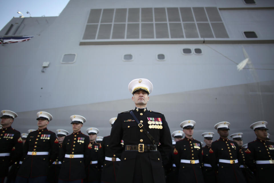 U.S. Marines stand at attention during a commissioning ceremony for the USS Somerset (LPD 25) Saturday Mar. 1, 2014, in Philadelphia. The USS Somerset is the ninth San Antonio-class amphibious transport dock and the third of three ships named in honor of those victims and first responders of the attacks on the World Trade Center and the Pentagon. The ship is named for the county where Flight 93 crashed after being hijacked on Sept. 11, 2001. (AP Photo/ Joseph Kaczmarek)