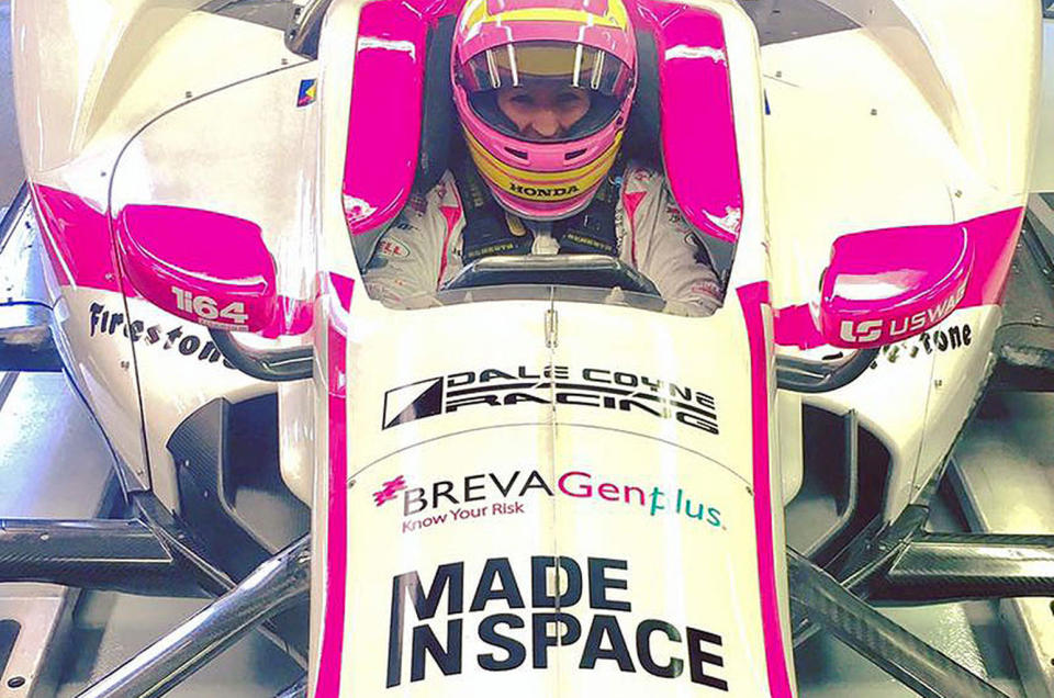 Pippa Mann in her Indianapolis 500 race car adorned with the Made In Space logo as an associate sponsor. <cite>Pippa Mann</cite>