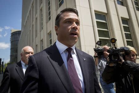 Representative Michael Grimm (R-NY) exits the Brooklyn Federal Courthouse in the Brooklyn Borough of New York in this May 19, 2014 file photo. REUTERS/Brendan McDermid/Files