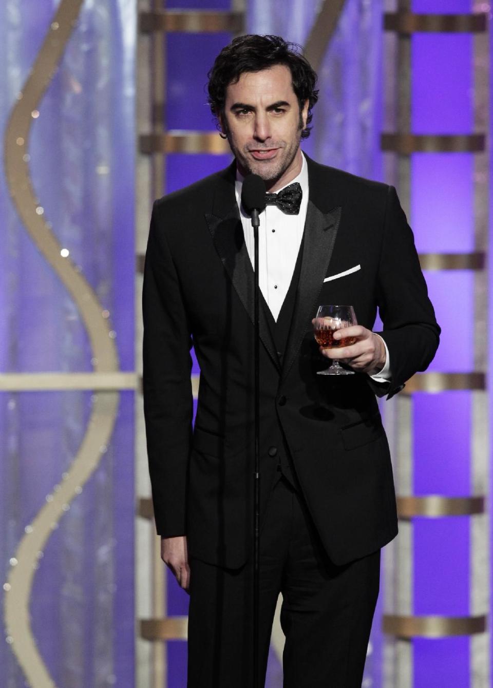 This image released by NBC shows presenter Sacha Baron Cohen during the 70th Annual Golden Globe Awards at the Beverly Hilton Hotel on Jan. 13, 2013, in Beverly Hills, Calif. (AP Photo/NBC, Paul Drinkwater)