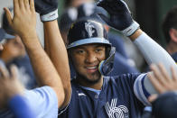 Kansas City Royals' Edward Olivares celebrates with teammates after hitting his second home run of the night during the fifth inning of a baseball game against the Oakland Athletics, Friday, June 24, 2022, in Kansas City, Mo. (AP Photo/Reed Hoffmann)