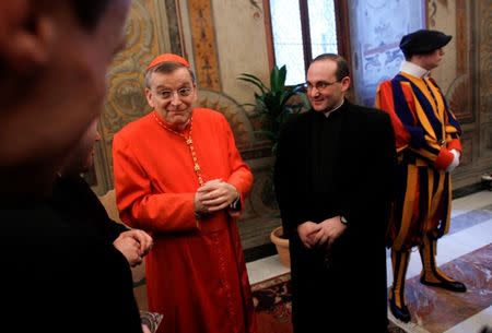 FILE PHOTO: New cardinal Raymond Leo Burke of the U.S. receives guests in the Apostolic Palace at the Vatican November 20, 2010. REUTERS/Tony Gentile/File photo