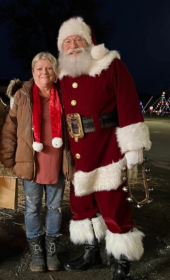 Susie Kaiser, posing with Santa on Dec. 22, 2023, at Homeworth Community Group Knox Township Christmas Drive Thru, was named the group's 2023 Citizen of the Year.