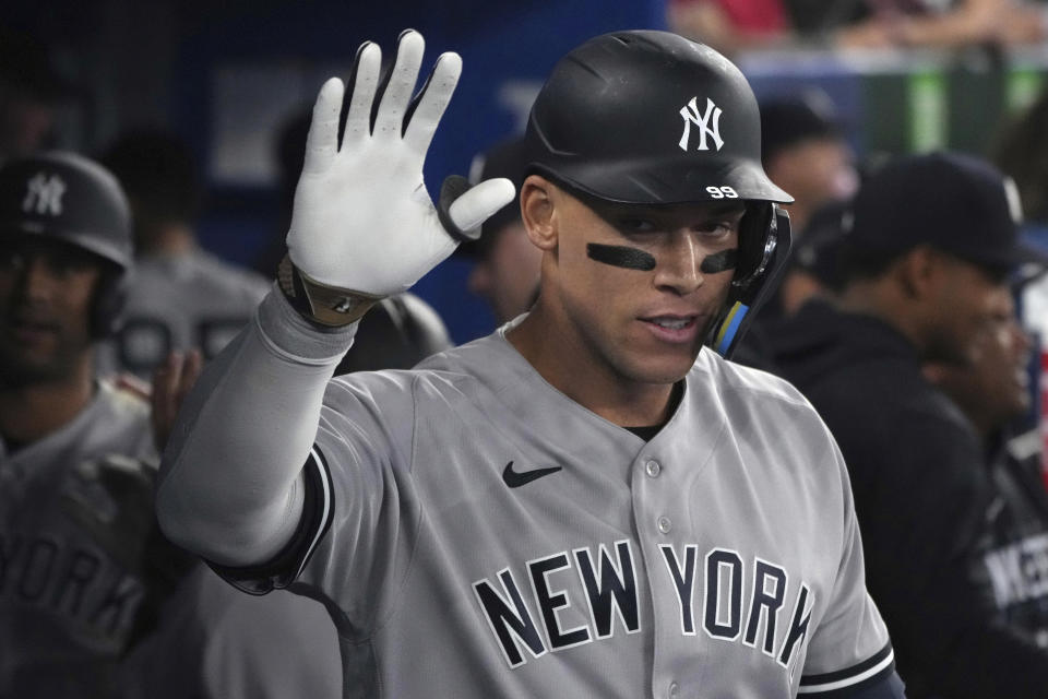 New York Yankees' Aaron Judge (99) celebrates his two-run home run against the Toronto Blue Jays during the eighth inning of a baseball game Tuesday, May 16, 2023, in Toronto. (Chris Young/The Canadian Press via AP)