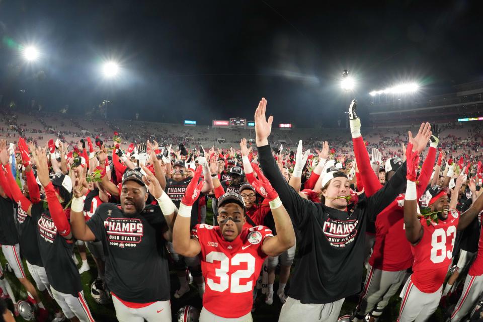 Jan 1, 2022; Pasadena, California, USA; Ohio State Buckeyes players celebrate after the 2022 Rose Bowl against the Utah Utes at Rose Bowl. Ohio State defeated Utah 48-45. Mandatory Credit: Kirby Lee-USA TODAY Sports