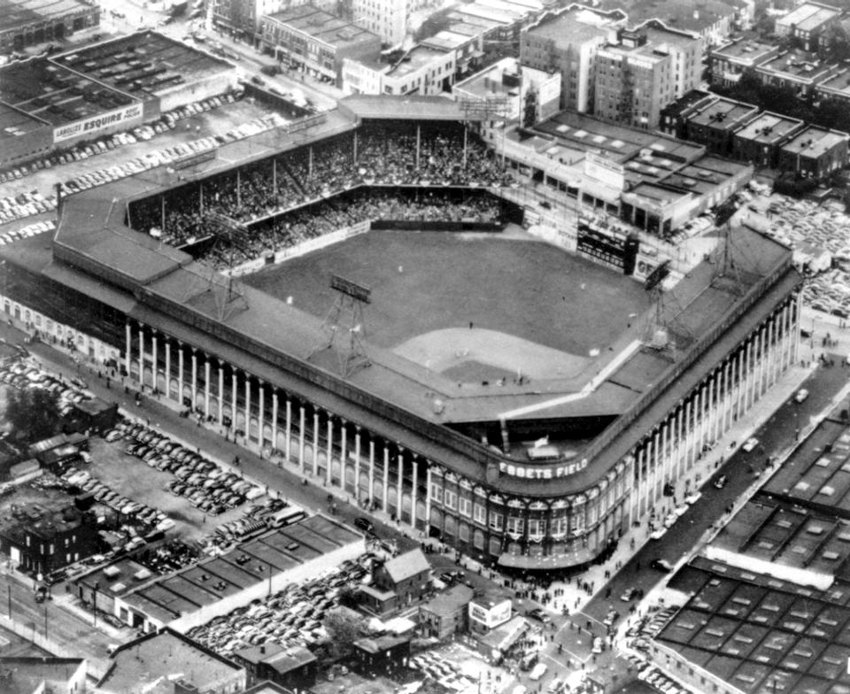 FILE - This file photo of Sept. 13, 1942 gives an aerial view of Ebbets Field, home to the Brooklyn Dodgers baseball team, in Brooklyn, New York. It was like a death in the family for Brooklyn baseball fans when their beloved Dodgers left the borough behind for the California coast. But after decades without a professional sports team, Brooklyn is hitting the major leagues again on Friday, Sept. 21, 2012 when the Brooklyn Nets’ new arena opens to the public. (AP Photo/Tom Fitzsimmons, File)