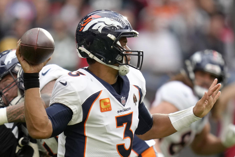 Denver Broncos quarterback Russell Wilson (3) throws the ball during the NFL football game between Denver Broncos and Jacksonville Jaguars at Wembley Stadium London, Sunday, Oct. 30, 2022. (AP Photo/Kirsty Wigglesworth)