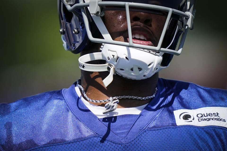 New York Giants running back Saquon Barkley wears a bejeweled number 26 during drills at the NFL football team's training camp, Wednesday, July 27, 2022, in East Rutherford, N.J. (AP Photo/John Minchillo)