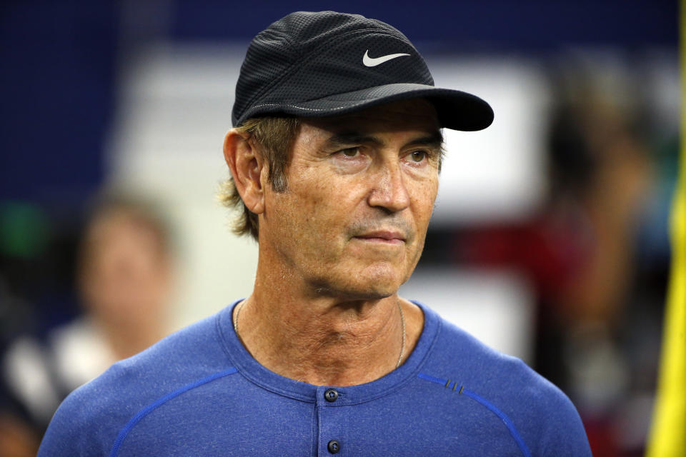 Former Baylor head football coach Art Briles watches the Dallas Cowboys and the Chicago Bears warm up before an NFL football game, Sunday, Sept. 25, 2016, in Arlington, Texas. (AP Photo/Ron Jenkins)