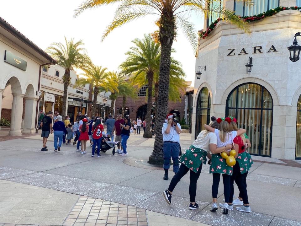 Disney fans celebrate the holidays together at Disney Springs in December 2021.