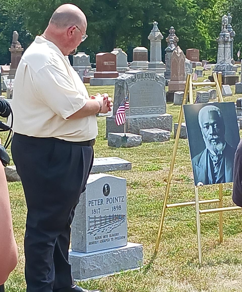 Gene Smith, curator of Clyde Museum, after the unveiling of the headstone of Peter Pointz at McPherson Cemetery.