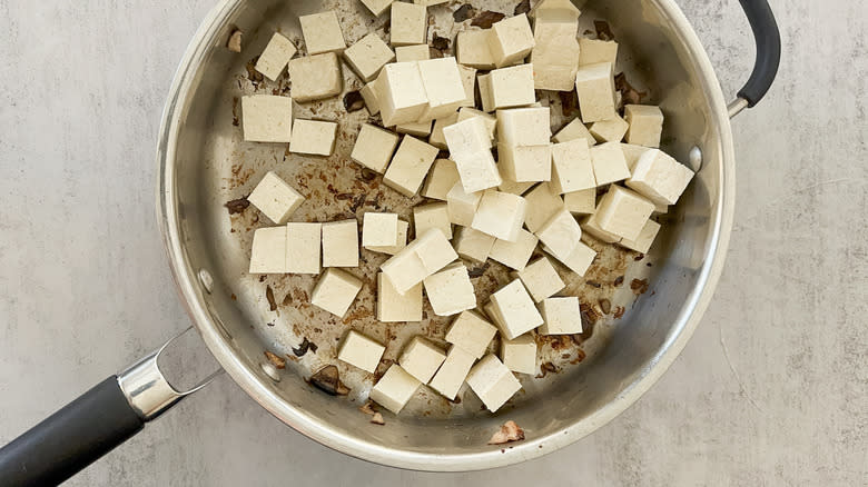 cubed tofu in skillet