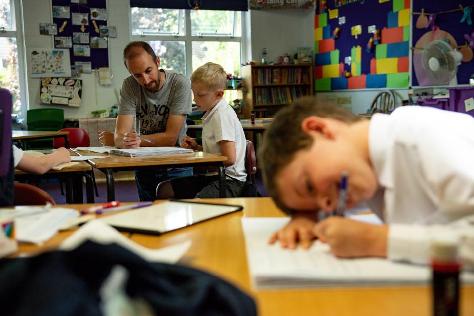 (PA) Primary school children of essential workers social-distancing in the classroom