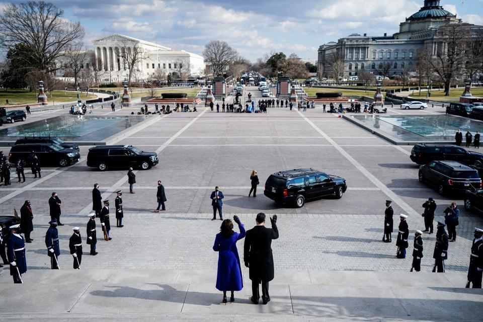 Vice President Kamala Harris and husband Doug Emhoff wave goodbye to former VP Mike Pence and his wife as they leave after the 59th Presidential Inauguration ceremony on January 20, 2021, at the US Capitol in Washington, DC. (Melina Mara/Pool/AFP via Getty Images)