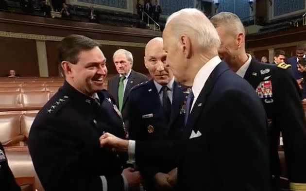 President Joe Biden lightly taps his fist on a top military leader at the State of the Union address. 