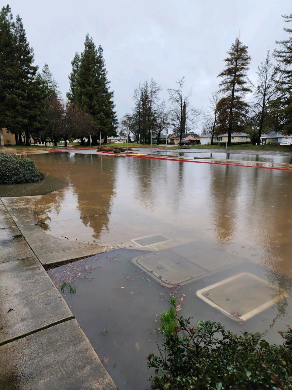 A parking lot flooded at Hong-Kingston Elementary School in Stockton Jan. 9.